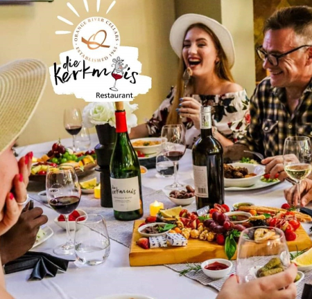 Die Kerkmuis wine tasting experience with people enjoying wine and food